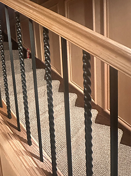 Banister balusters installed on interior wood staircase