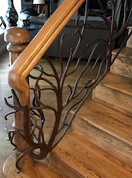 Custom balusters with decorative branch style iron design