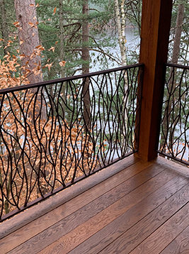 Deck balusters installed on exterior wood porch railing