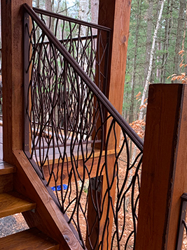 Deck railing spindles installed on exterior balcony system