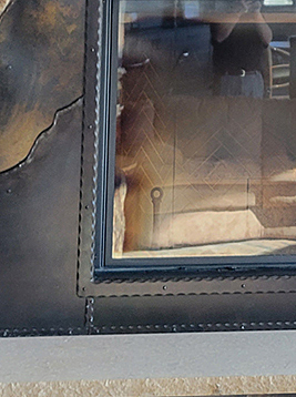 Hammered flat bar used in decorative metal door frame