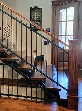 Iron stair spindles installed on traditional interior staircase
