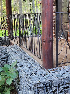 Metal deck balusters installed on exterior wood porch railing