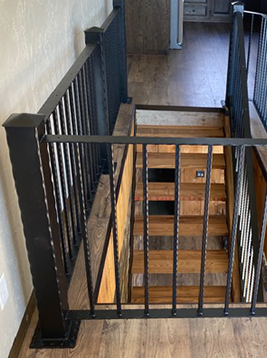 Metal railing balusters installed on interior stair landing