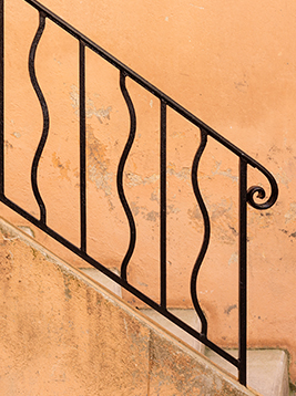 Modern metal stair balusters with curved vertical design