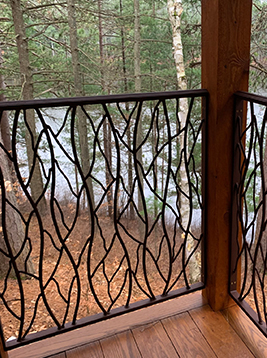 Porch balusters installed on exterior wood porch railing