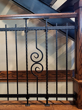 Railing balusters with decorative scroll center design