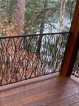 Round deck balusters installed on exterior balcony railing