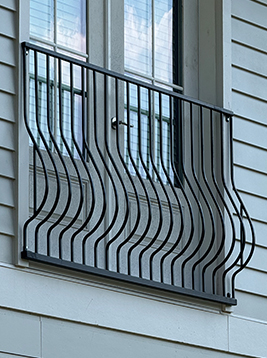 Square deck balusters installed on exterior house railing