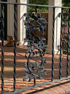 Square metal deck balusters installed on exterior brick balcony