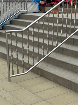 Stainless steel balusters installed on commercial stair railing