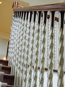Staircase steel spindles installed on interior stair railing