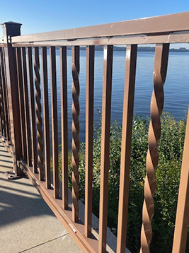 Steel deck balusters installed on waterfront balcony railing