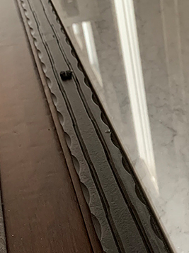 Textured flat bar with hammered metal edge detail