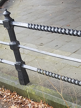 Twisted square bars used in exterior metal railing system