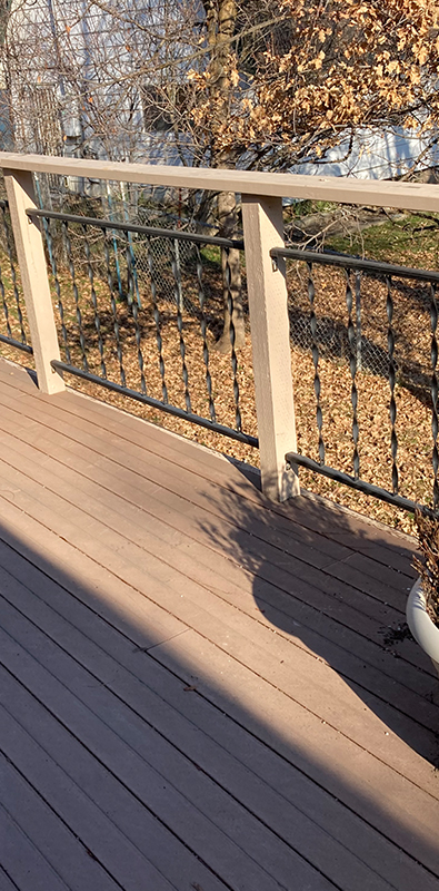 Aluminum railing balusters installed on exterior deck system