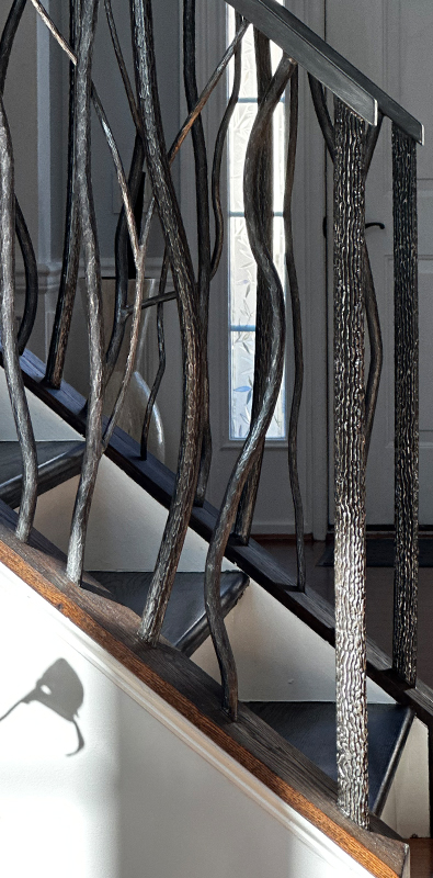 Aluminum spindles installed on decorative interior stair railing