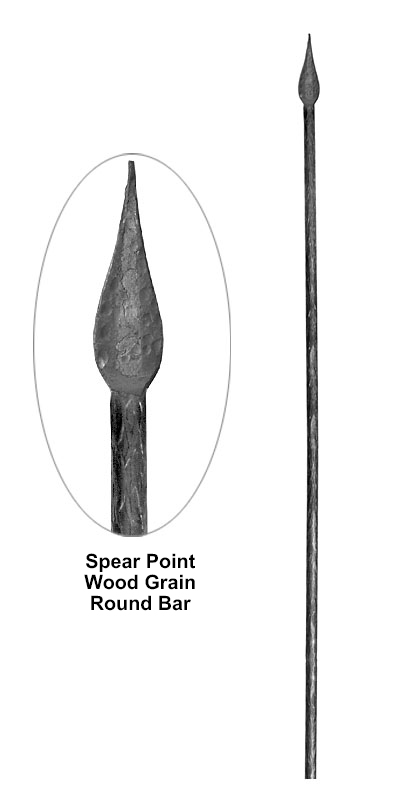 Spear point wood grain round bar metal bar detail showing wood grain texture with forged spear tip