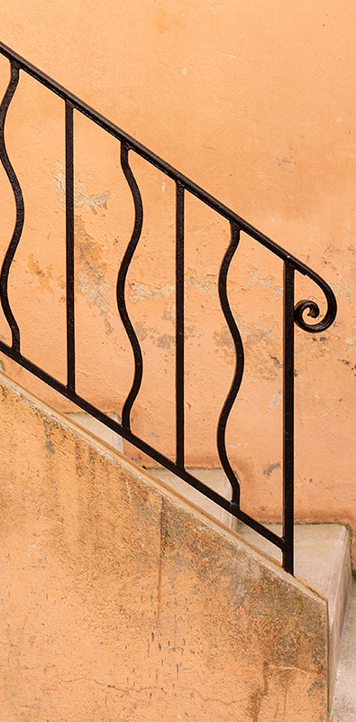 Modern metal stair balusters with curved vertical design