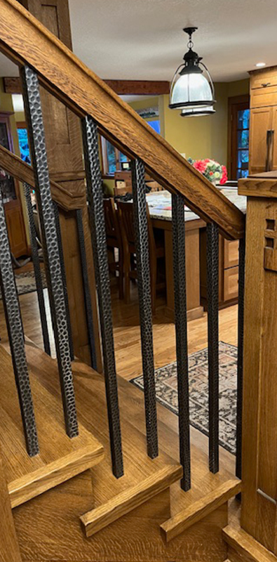 Square aluminum balusters installed on interior wood staircase