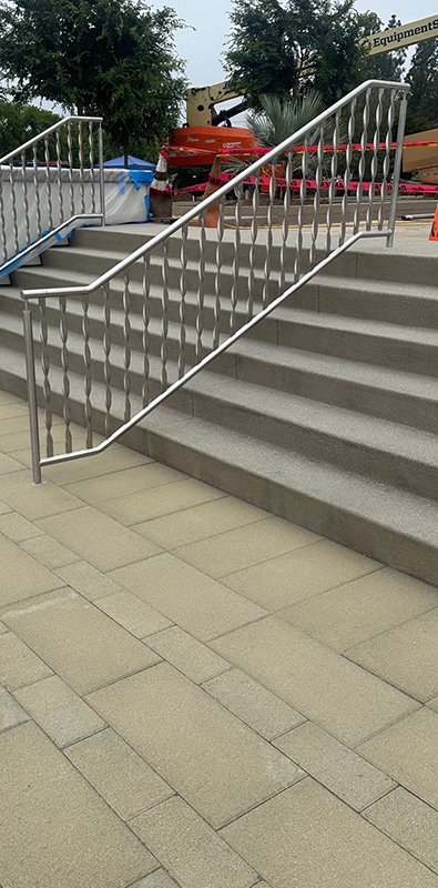 Stainless steel balusters installed on commercial stair railing