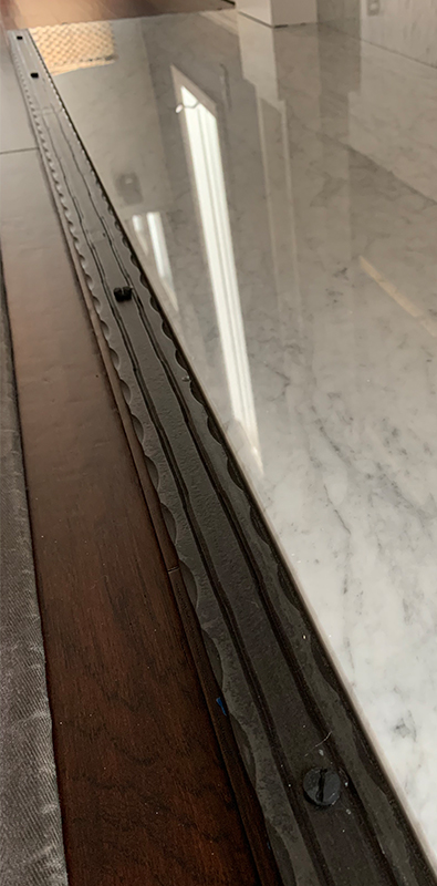 Textured flat bar with hammered metal edge detail