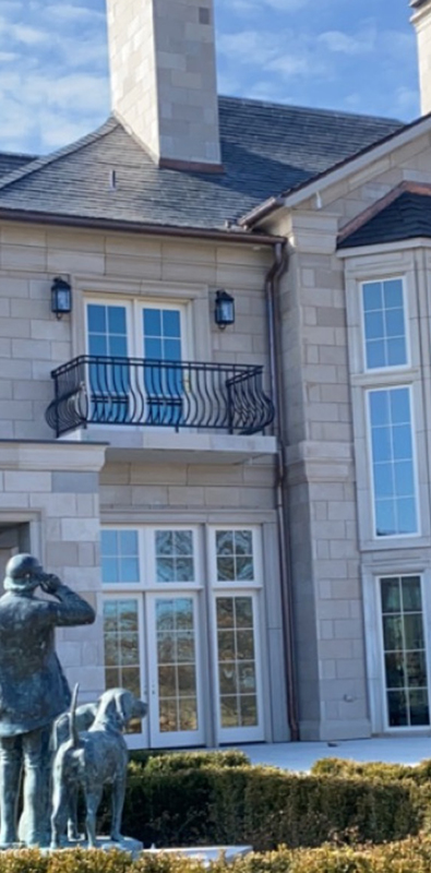 Wrought iron deck spindles installed on exterior balcony railing