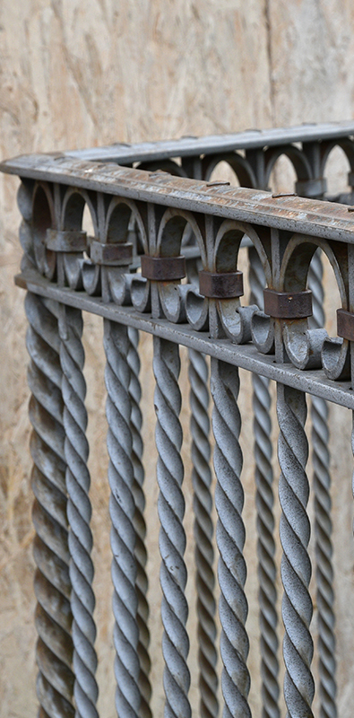 Wrought iron railing balusters with twisted decorative design